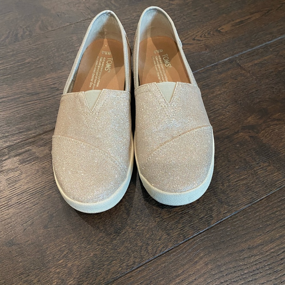 Toms Women’s Gold Slip Ons
